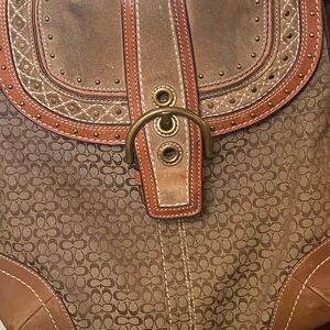 Coach Brown Shoulder Bag with Flap Closure and Decorative Stitching